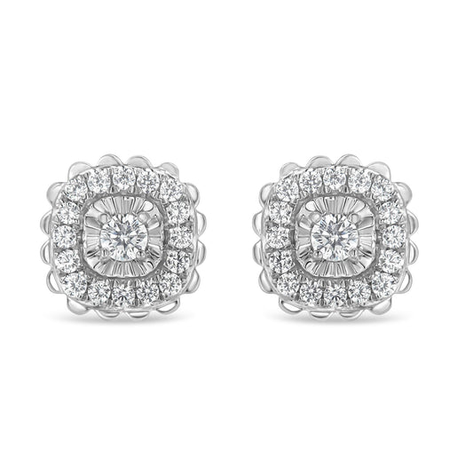 Front view of white metal stud earrings featuring a central round white gemstone in prong setting surrounded by two rows of round white gemstones, the inner row in miracle setting and the outer row in prong setting.