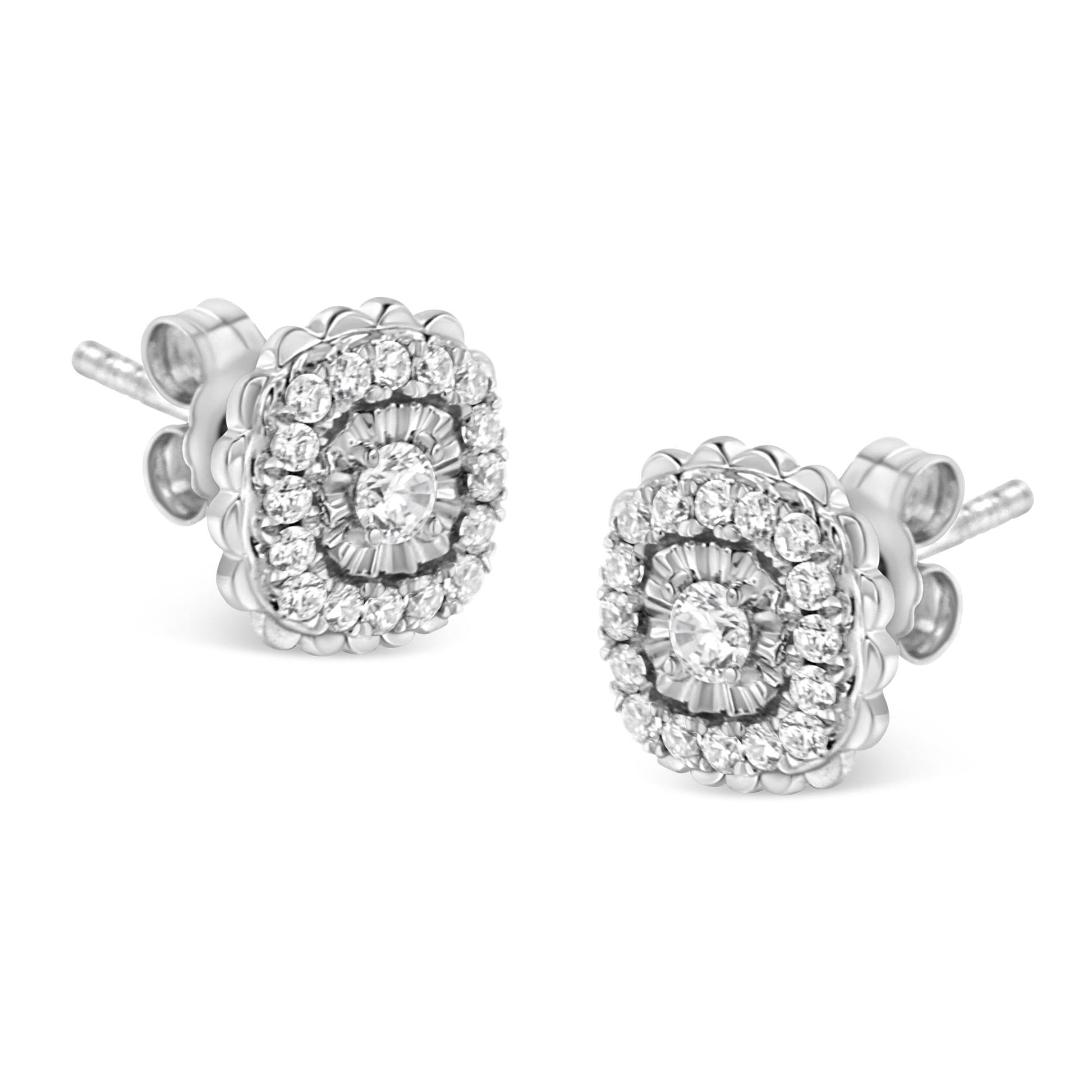 Close-up front angle view of a pair of white metal stud earrings with round white gemstones in miracle and prong settings.