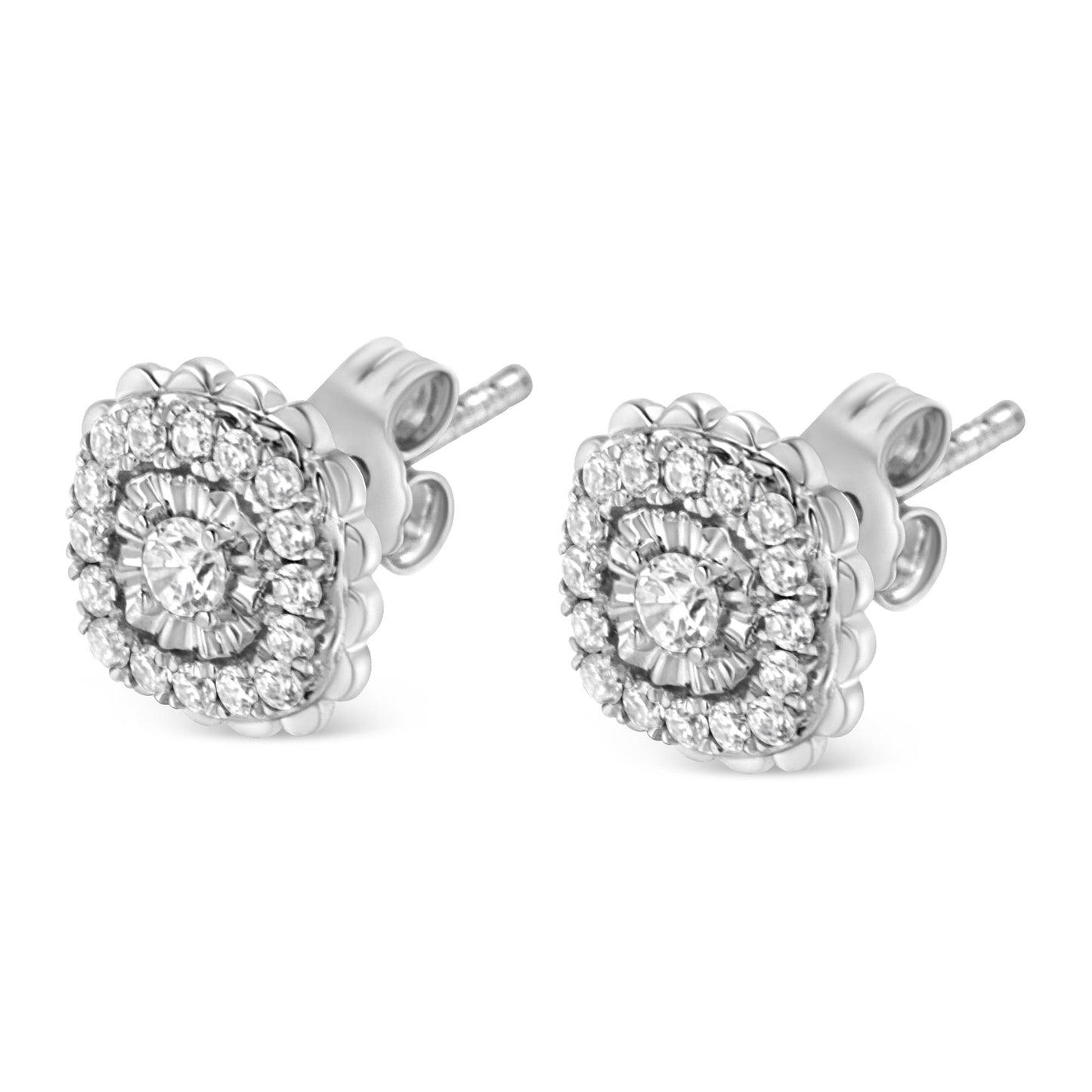 Pair of white metal stud earrings with round white gemstones in miracle and prong settings, shown at a slight angle.
