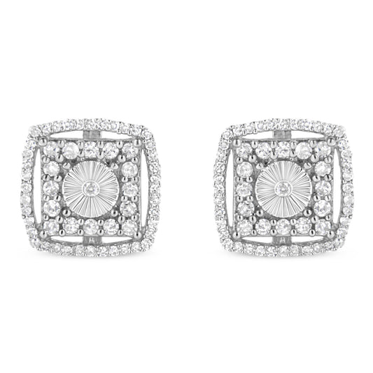 Pair of white metal square-shaped earrings with round bezel-set white gemstones in the center, surrounded by multiple round shared-prong-set white gemstones, shown from the front angle.