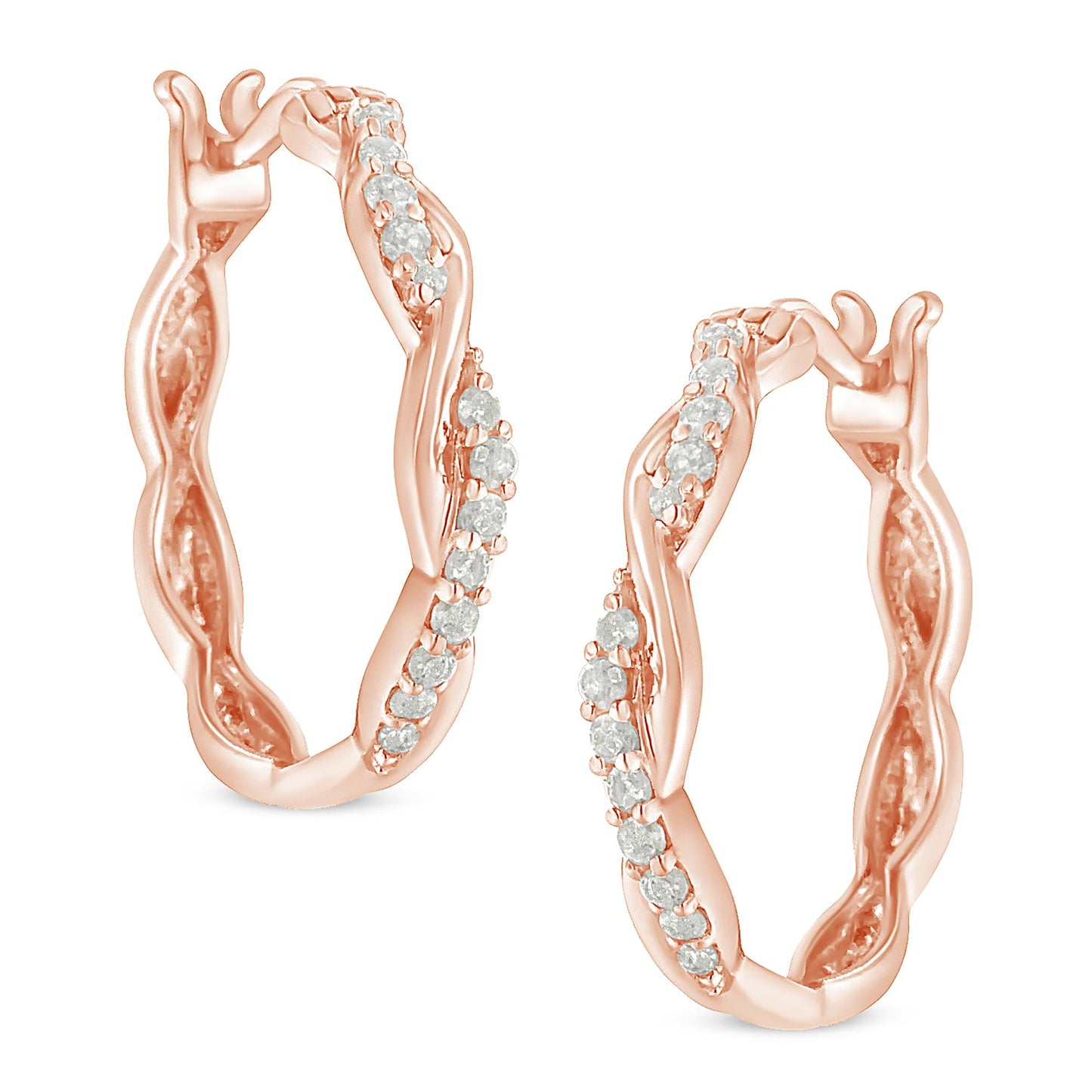 Close-up front angle of a pair of rose-colored hoop earrings with a twisted design and white round gemstones in pave setting.