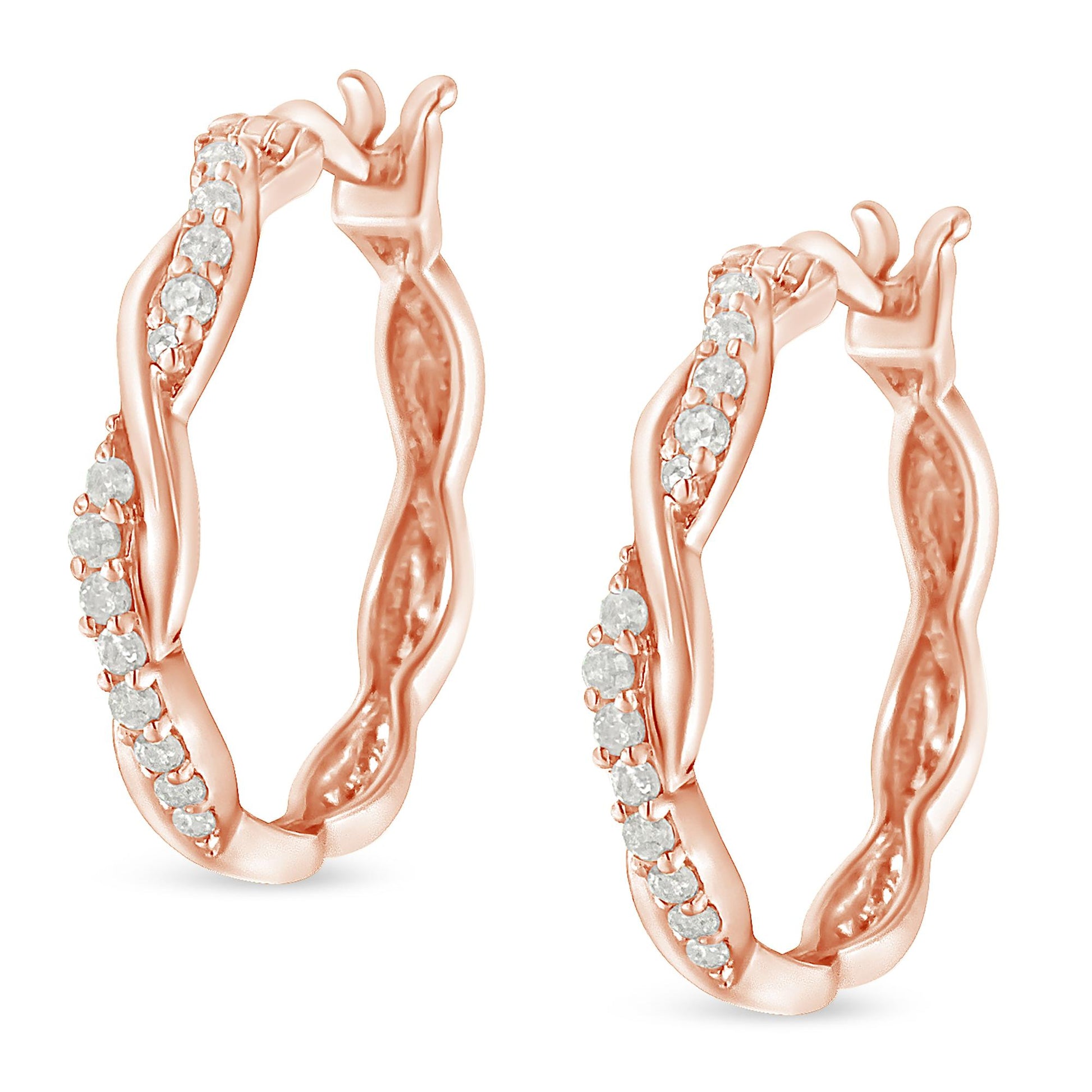 Pair of rose-colored hoop earrings with wavy design and white round gemstones in pave setting, shown from a front angled view.