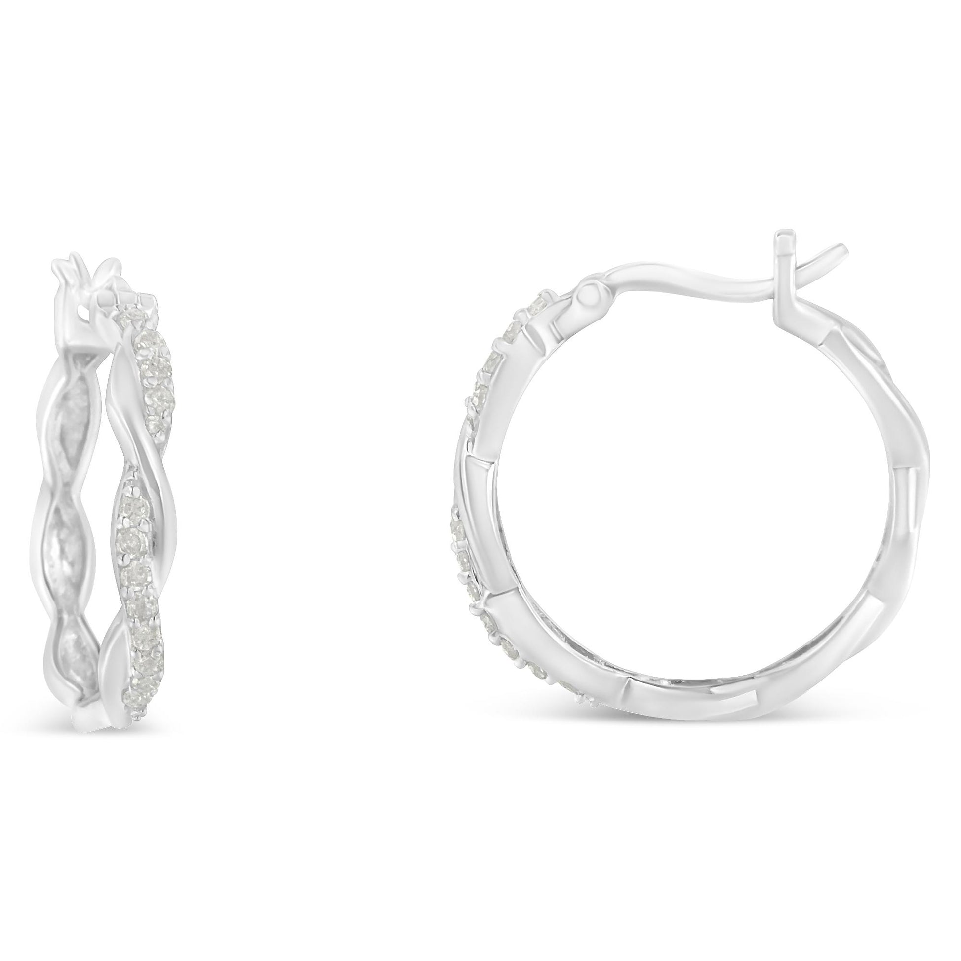 White metal hoop earrings with twisted design featuring pave-set round white gemstones, shown from side and front angles on a white background.