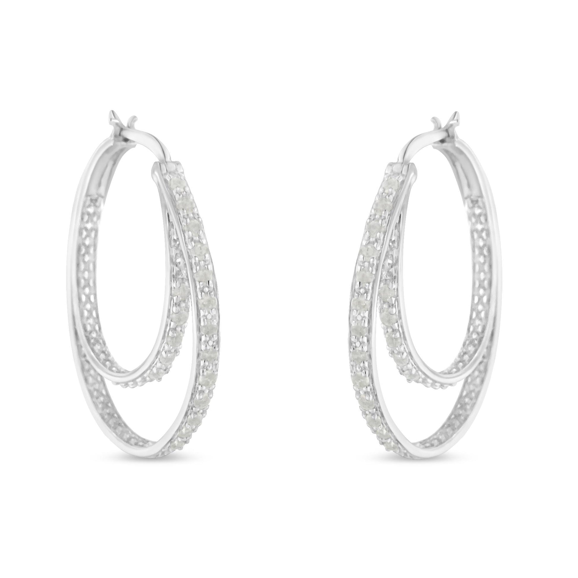 Pair of white metal hoop earrings with two rows of round white gemstones in pave setting, shown from a front angle.