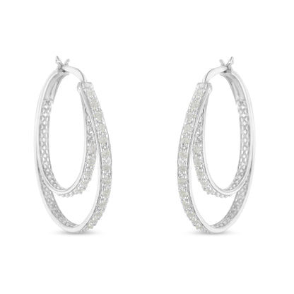 Pair of white metal hoop earrings with two rows of round white gemstones in pave setting, shown from a front angle.