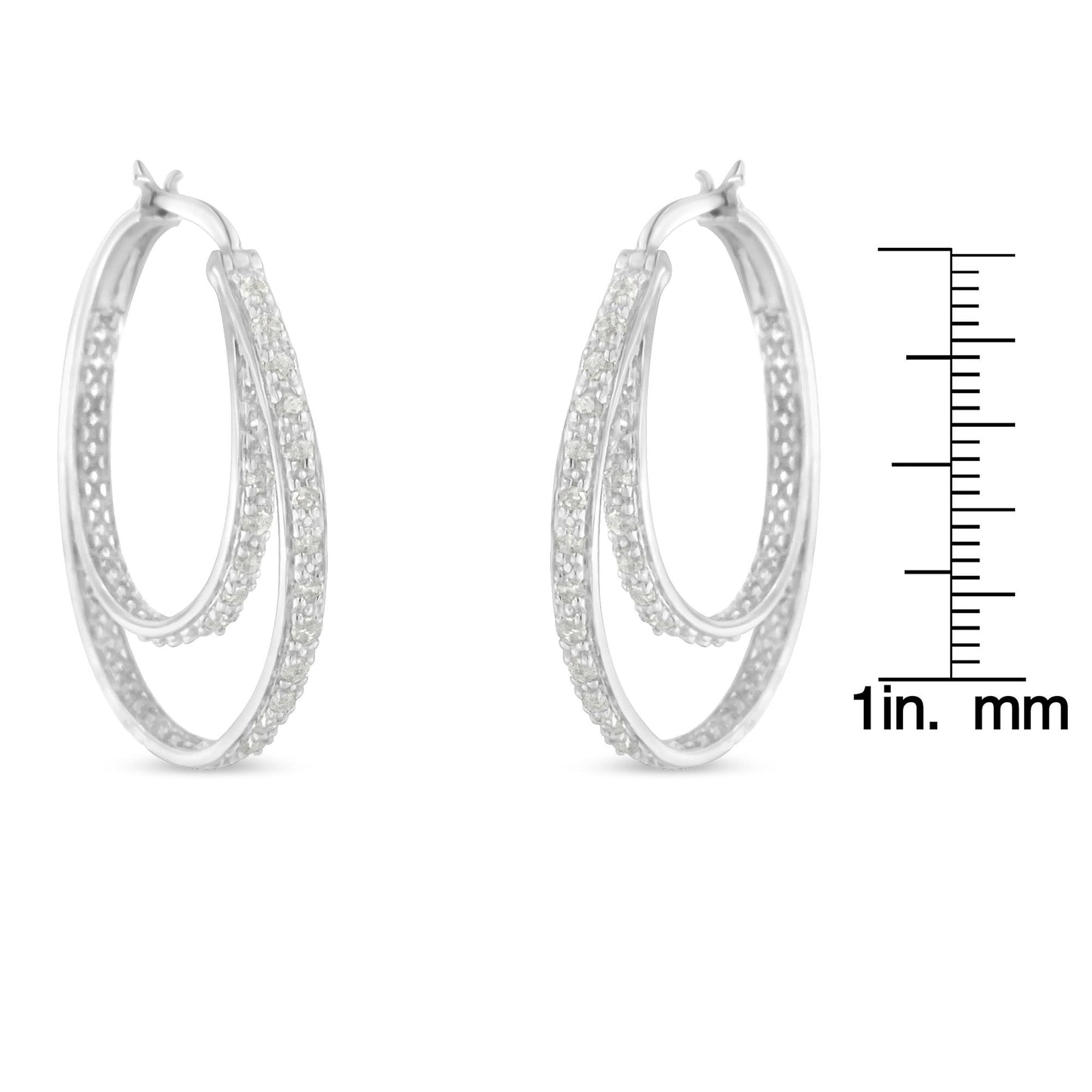 Pair of white metal double hoop earrings with pave-set round white gemstones, shown from a front angle next to a ruler for size reference.