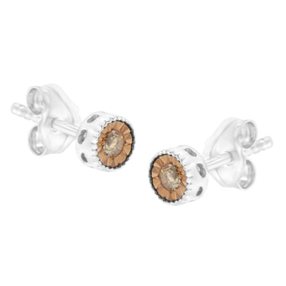 Pair of white metal stud earrings with round champagne-colored gemstones in the center, shown at an angled close-up.