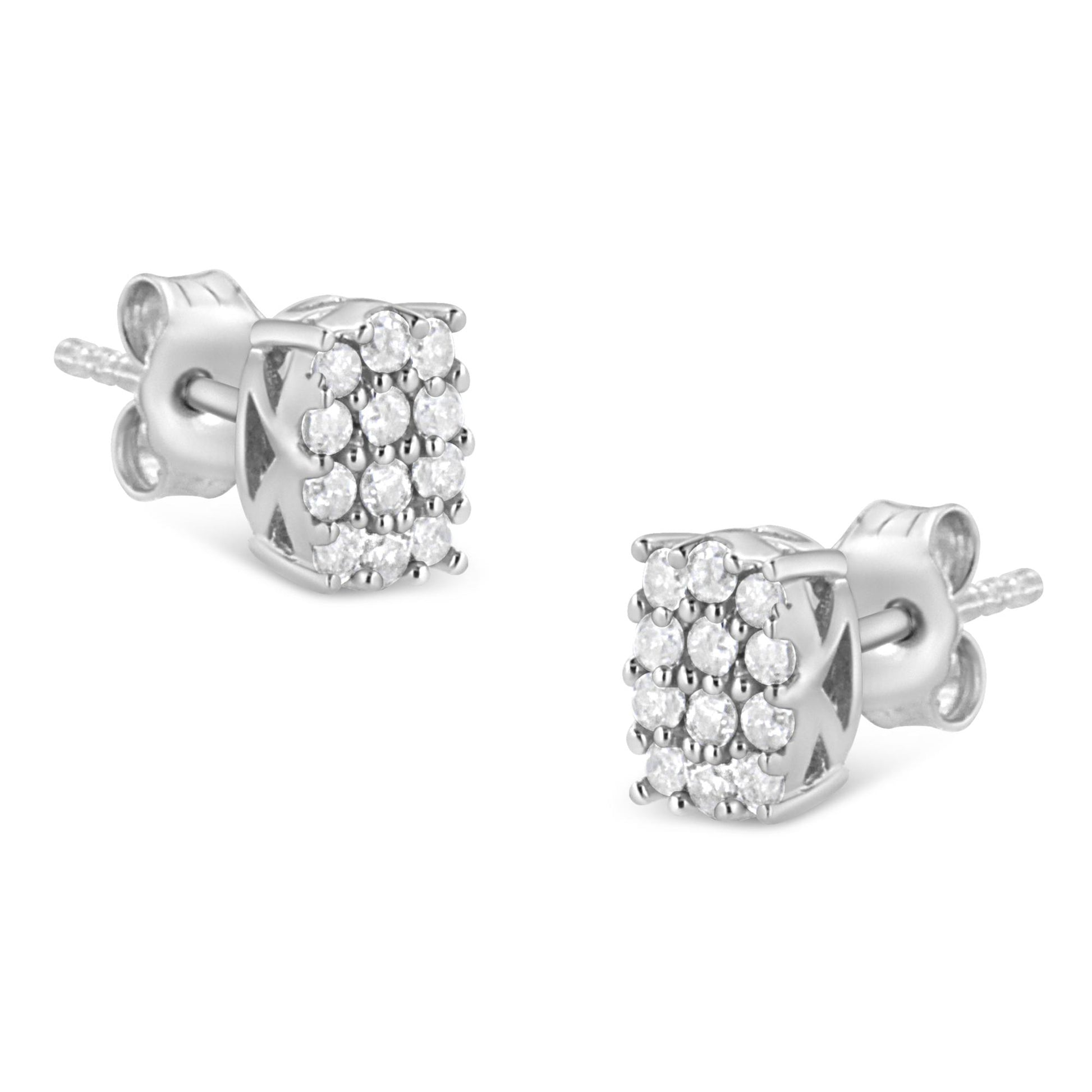 Pair of white metal stud earrings with square clusters of round white gemstones in prong settings, shown from a side angle.