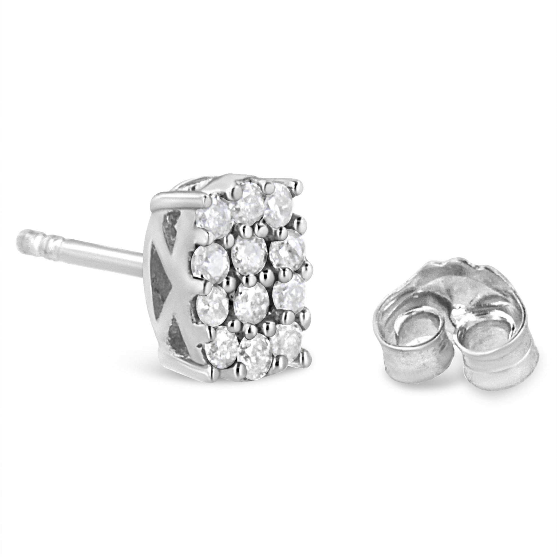 Close-up side angle of a white metal stud earring with multiple round white gemstones in prong setting, shown with its backing next to it.