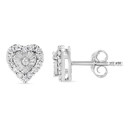 Front and side view of white metal heart-shaped stud earrings with small round white gemstones in prong and miracle settings.