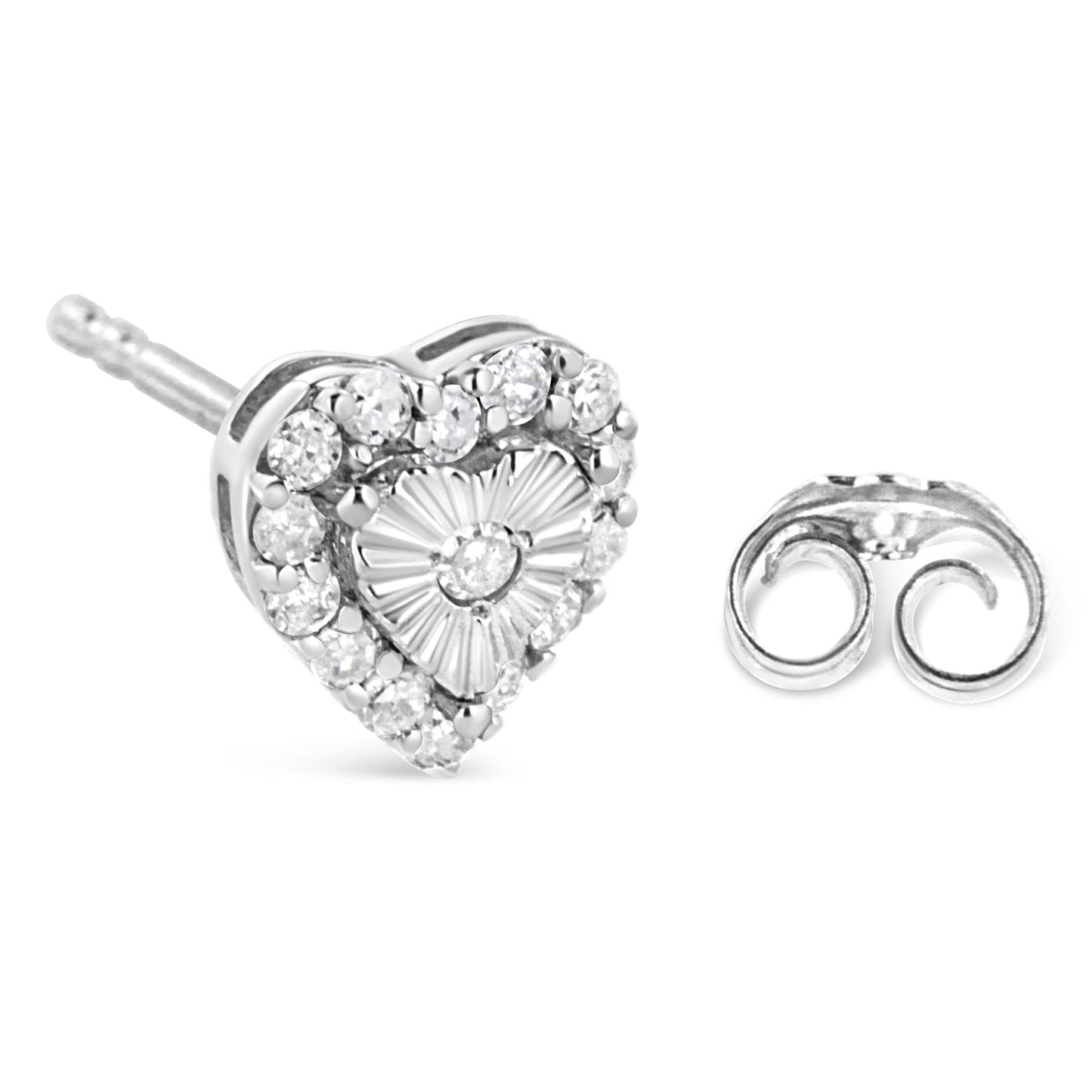 Close-up front angle of a white metal heart-shaped stud earring with a central white gemstone in miracle setting, surrounded by multiple white gemstones in prong setting, next to a separate earring back.