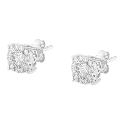 Pair of white metal stud earrings with round white gemstones in a pave setting, shown from a side angle.
