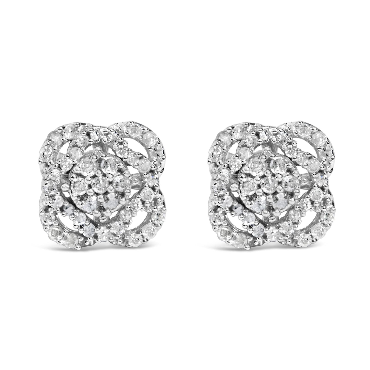 Front view of a pair of white metal stud earrings featuring multiple round white gemstones in prong settings arranged in a floral pattern.