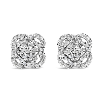 Front view of a pair of white metal stud earrings featuring multiple round white gemstones in prong settings arranged in a floral pattern.