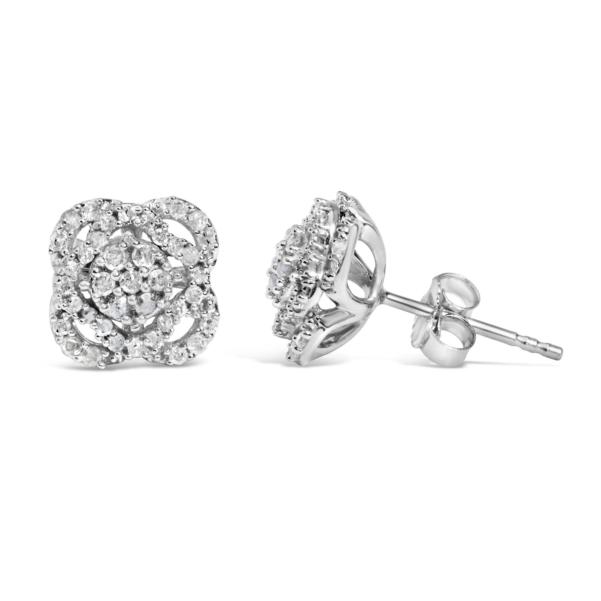 Pair of white metal stud earrings with round prong-set white gemstones, shown from front and side angles.