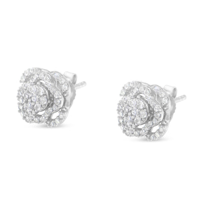 Pair of white metal stud earrings with round white gemstones in a floral cluster design, shown from a front angle.