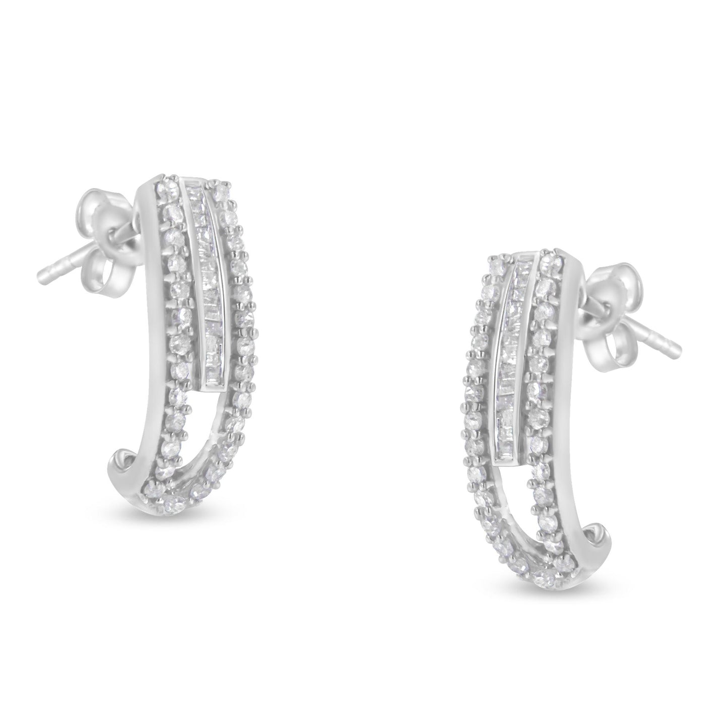Pair of white metal earrings with curved design featuring rows of round prong-set white gemstones and a central channel-set row of baguette white gemstones, shown from front angle.