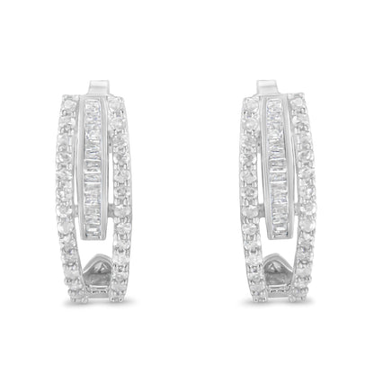 Front facing view of white metal earrings featuring rows of round prong-set white gemstones flanking a center row of baguette channel-set white gemstones.