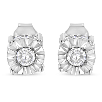 Front view of 1/2 cttw miracle set diamond stud earrings showcasing center round diamonds in miracle settings and channel-set accent stones on white background