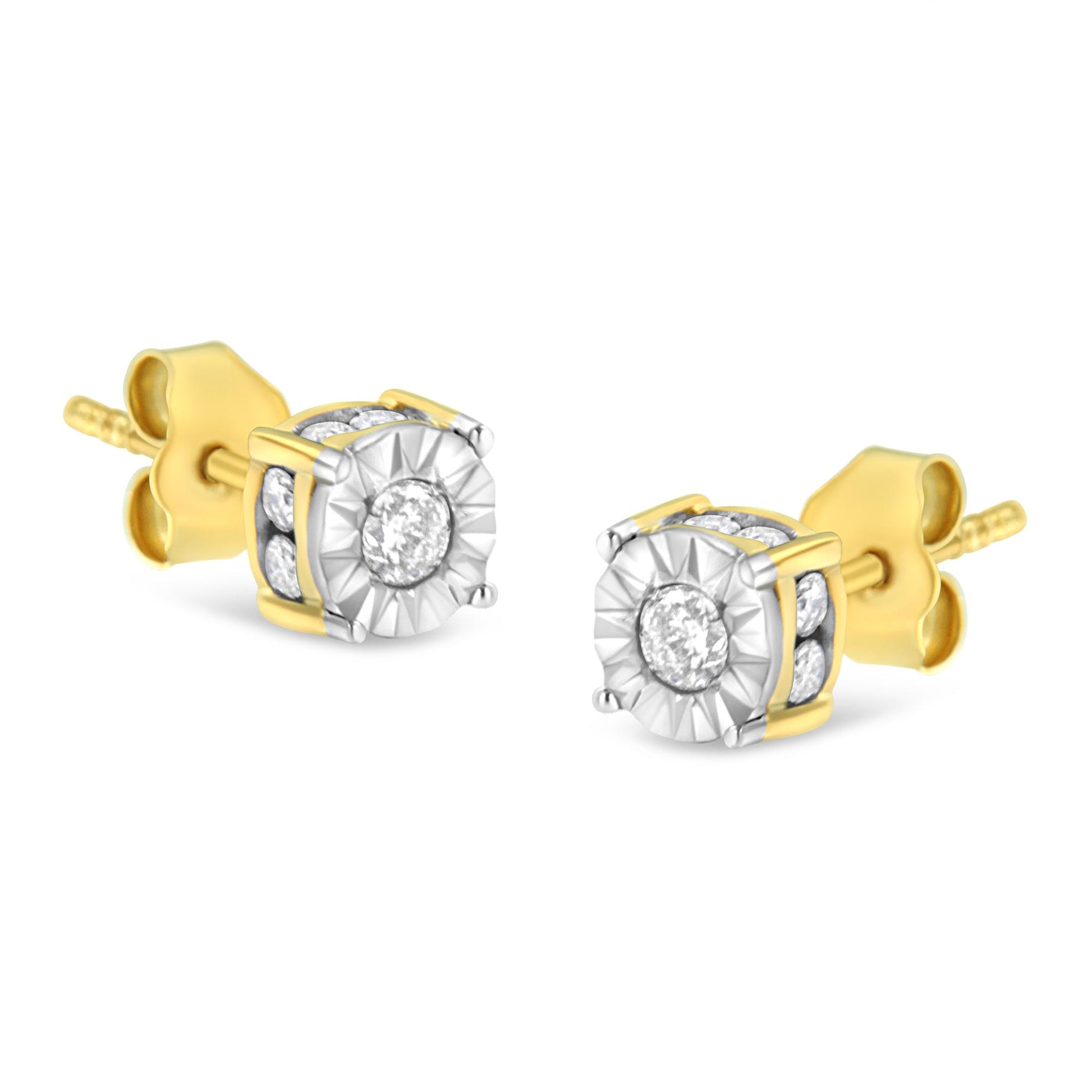 Pair of yellow metal stud earrings with round white gemstones in miracle and channel settings, shown at an angled front view.
