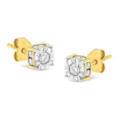Pair of yellow metal stud earrings with round white gemstones in miracle and channel settings, shown at an angled front view.
