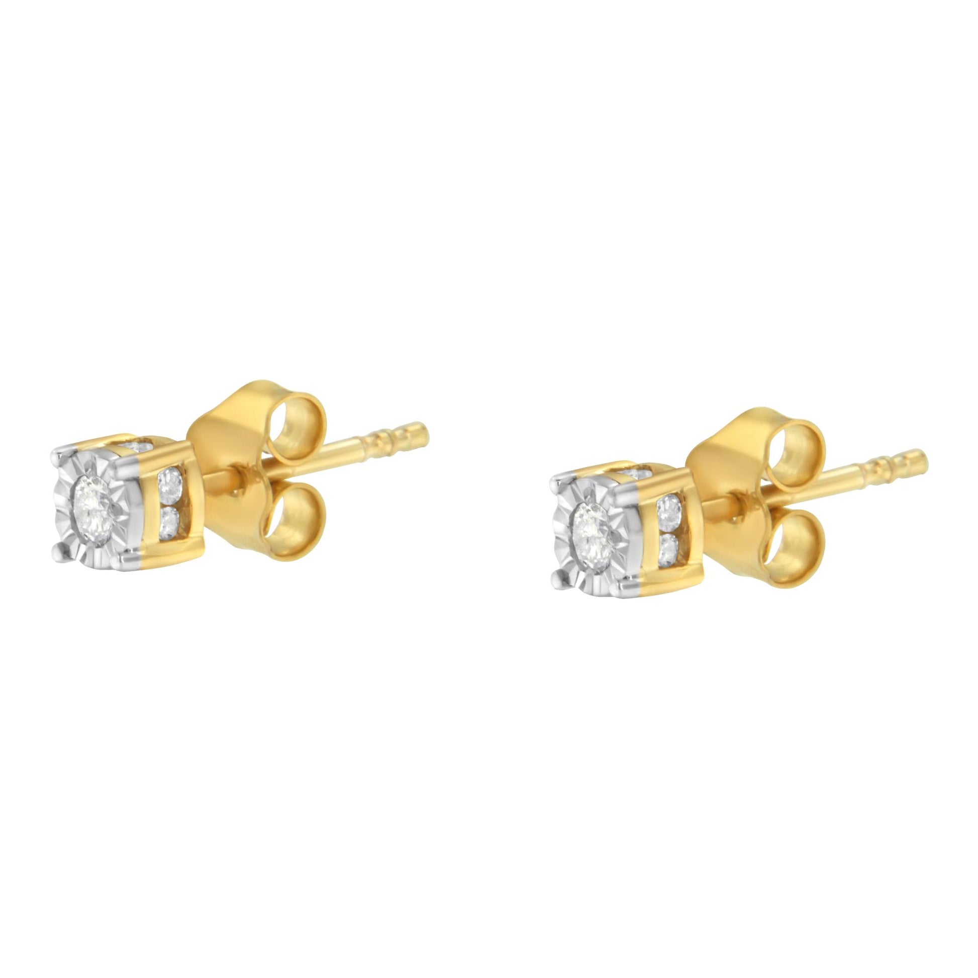 Pair of yellow metal stud earrings with round white gemstones in a miracle setting, shown from a side angle.