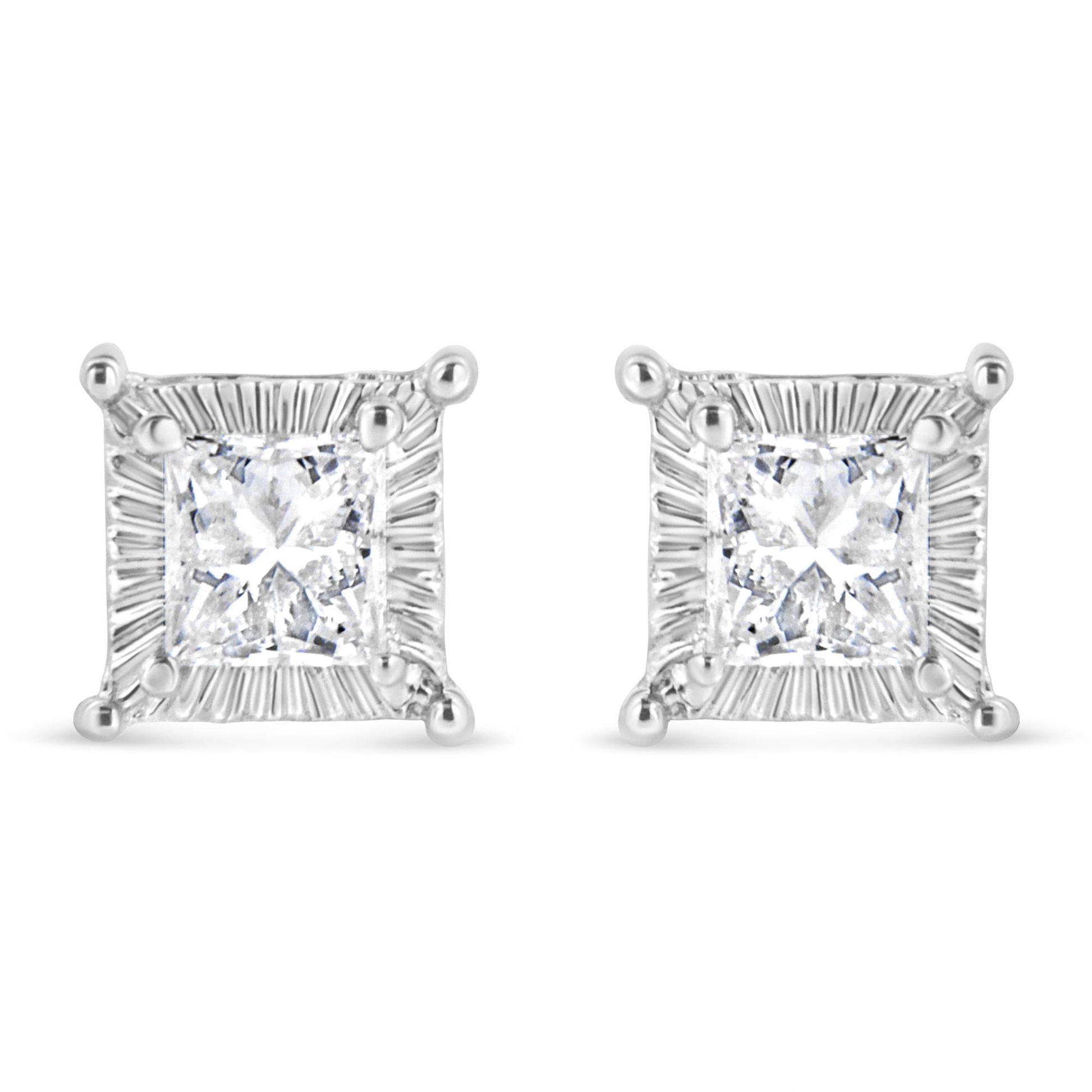 Front view of a pair of white metal square stud earrings featuring princess-shaped white gemstones with round white gemstones channel set around the edges.