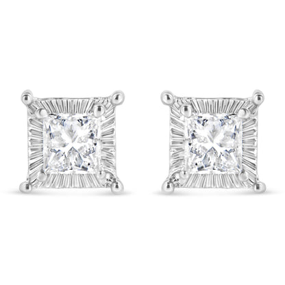 Front view of a pair of white metal square stud earrings featuring princess-shaped white gemstones with round white gemstones channel set around the edges.