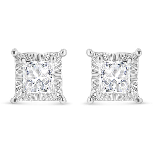 Front view of a pair of white metal square stud earrings featuring princess-shaped white gemstones with round white gemstones channel set around the edges.