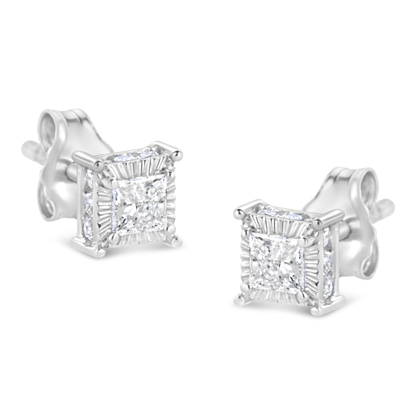 Pair of white metal stud earrings with princess shape white gemstones in the center surrounded by smaller round white gemstones on all sides, shown from an angled front view.