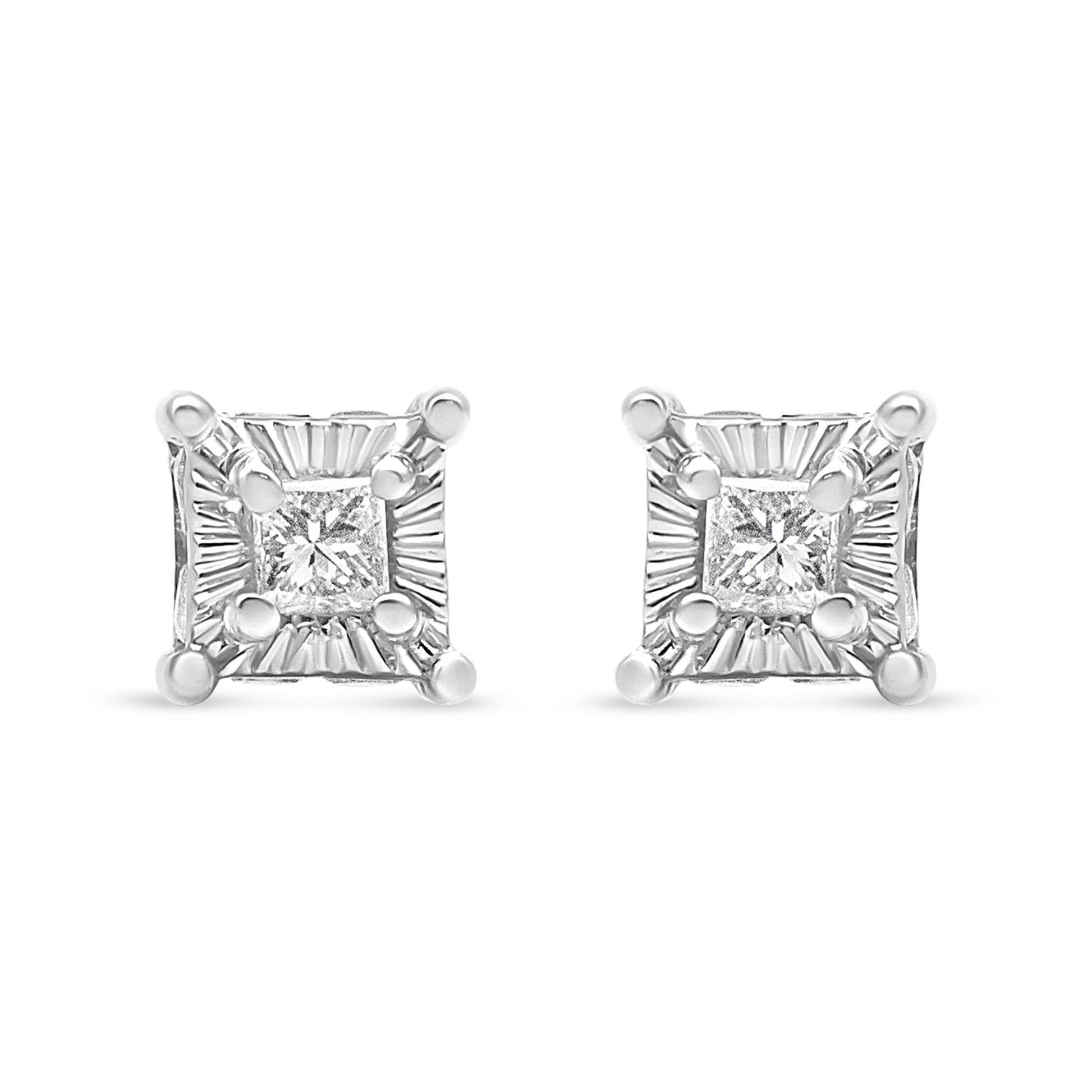 Front view of white metal stud earrings featuring square-shaped white gemstones with round white gemstones set around the edges.