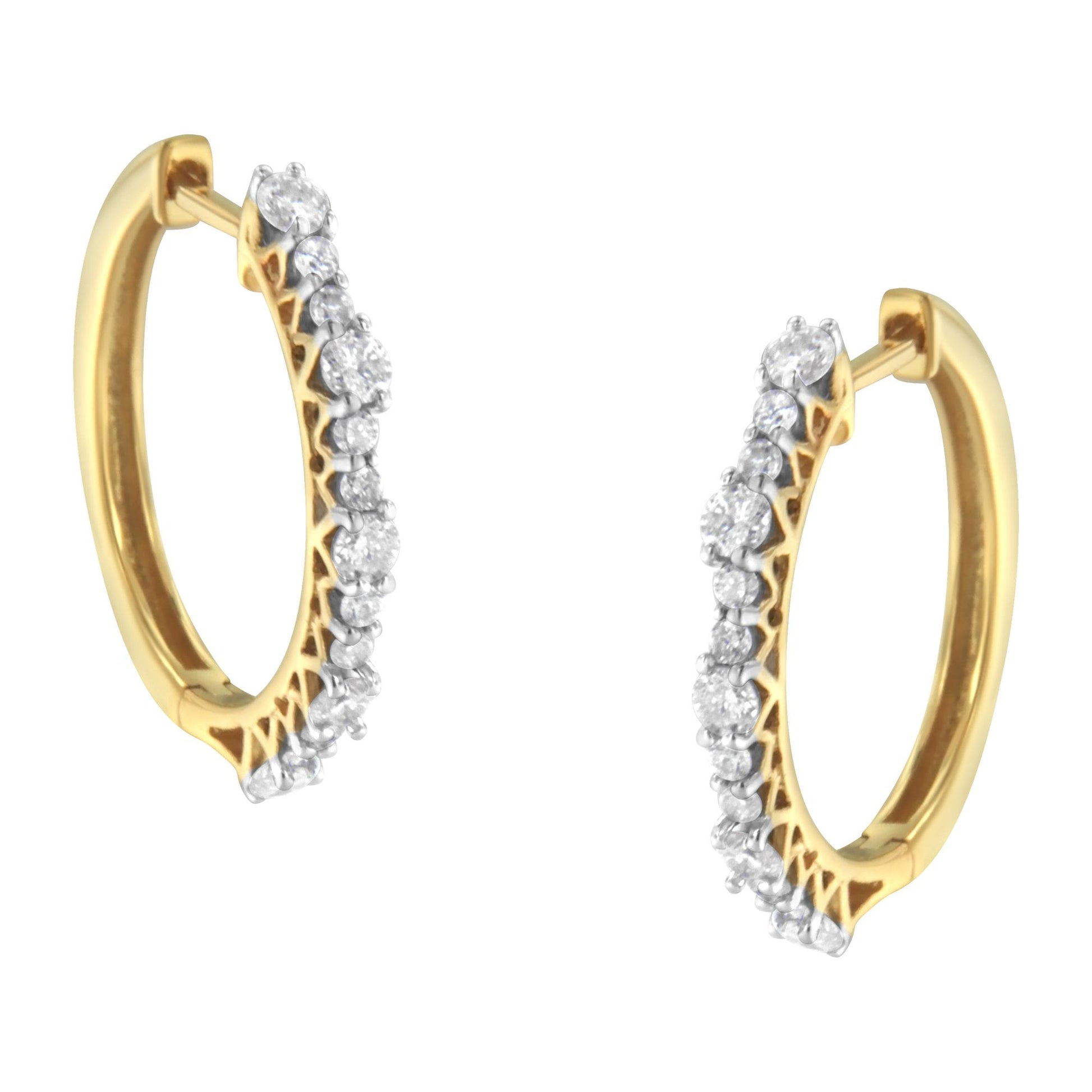 Pair of yellow hoop earrings with prong-set round white gemstones, shown from a front angle.