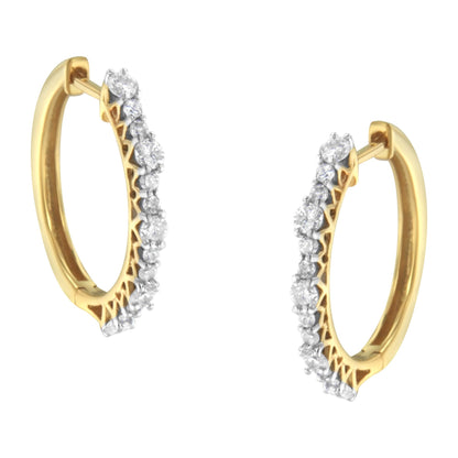 Pair of yellow hoop earrings with prong-set round white gemstones, shown from a front angle.
