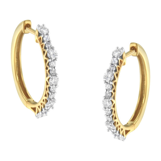 Pair of yellow hoop earrings with prong-set round white gemstones, shown from a front angle.