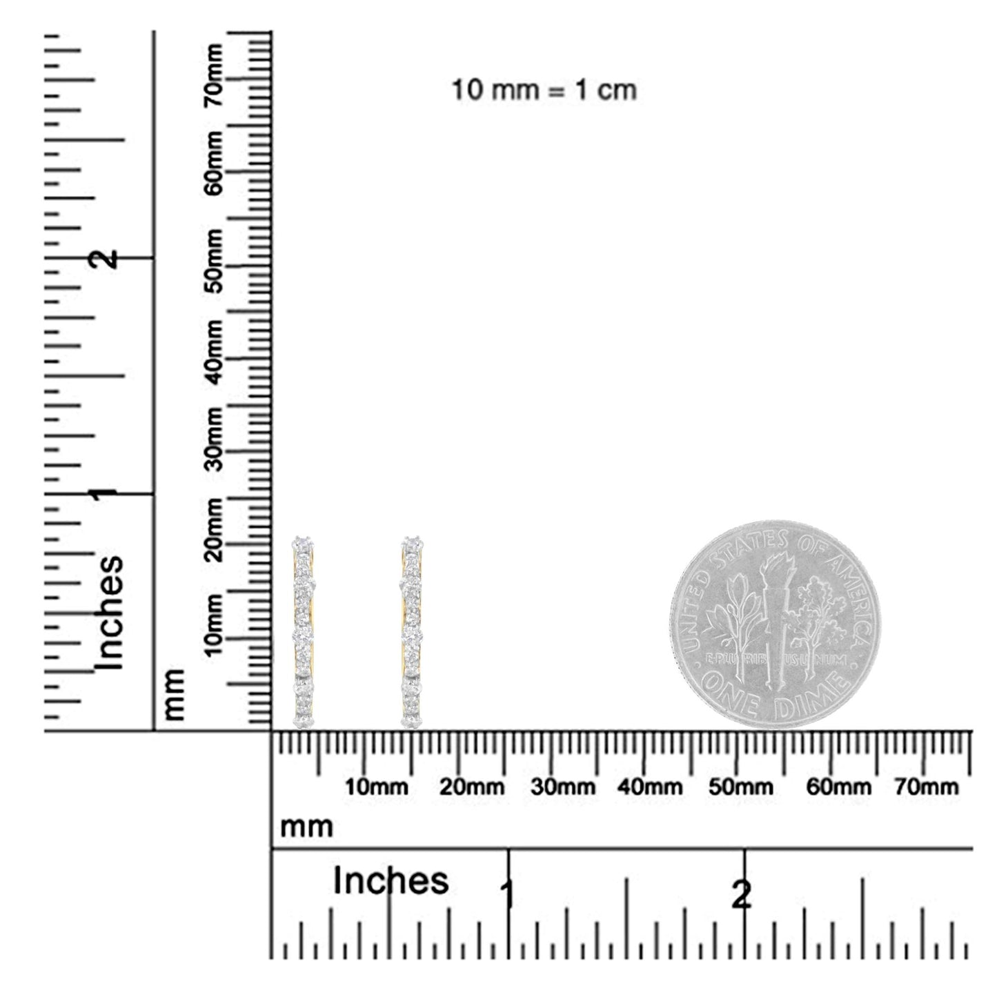 Pair of yellow metal earrings with multiple round white gemstones in prong settings, shown upright on a ruler and a dime for size reference, photographed from the front angle.