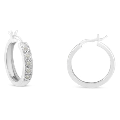 Pair of white metal hoop earrings with round white gemstones set in a row, shown from front and side angles on a white background.