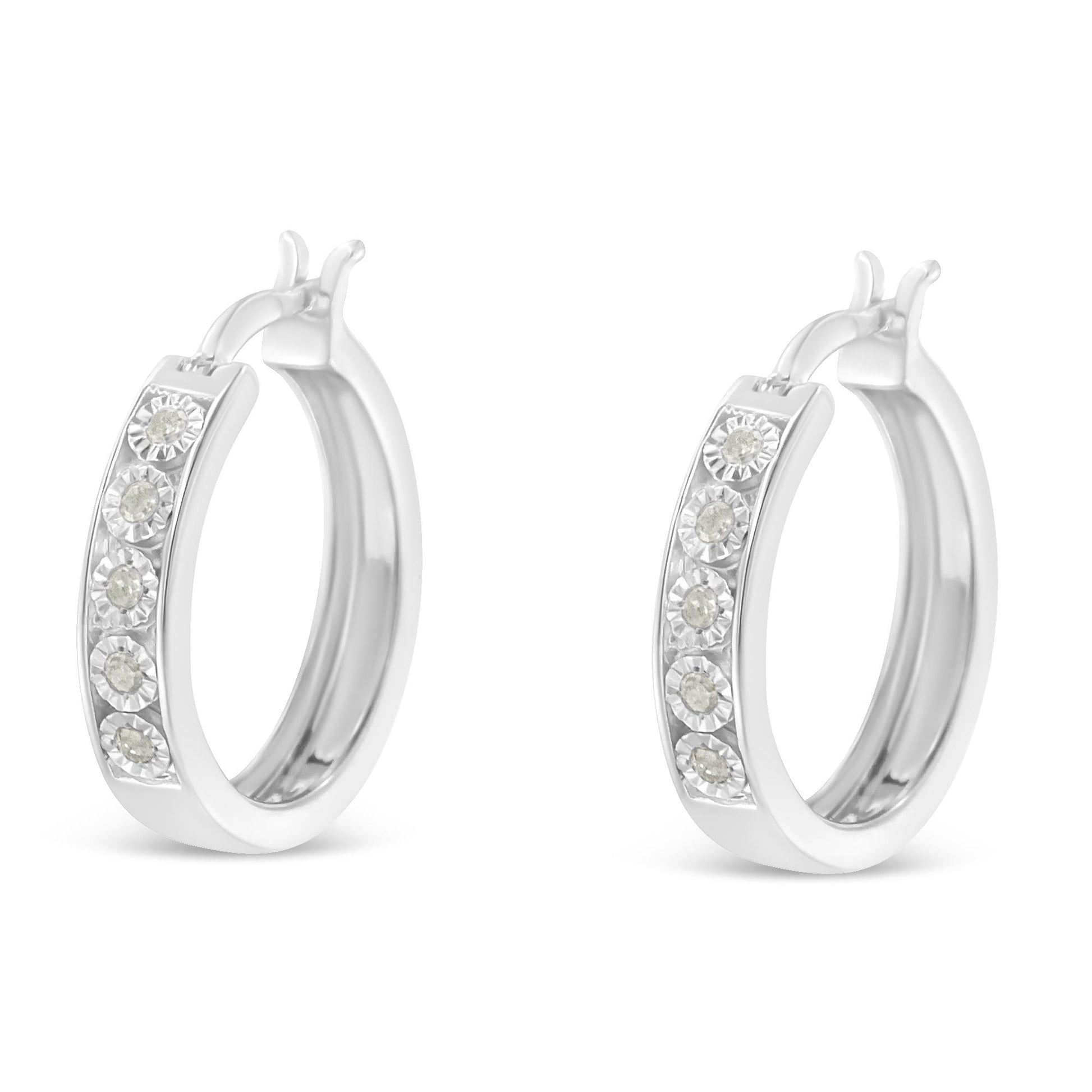Pair of white hoop earrings with round white gemstones set in a row along the front, shown in a front angle view.