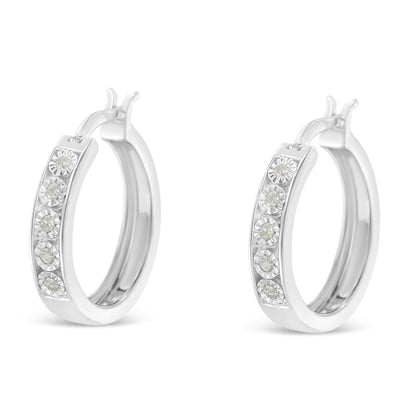 Pair of white hoop earrings with round white gemstones set in a row along the front, shown in a front angle view.