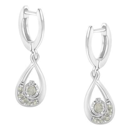 Front angle view of a pair of white metal earrings with a teardrop shape, featuring round white gemstones in a pave setting.