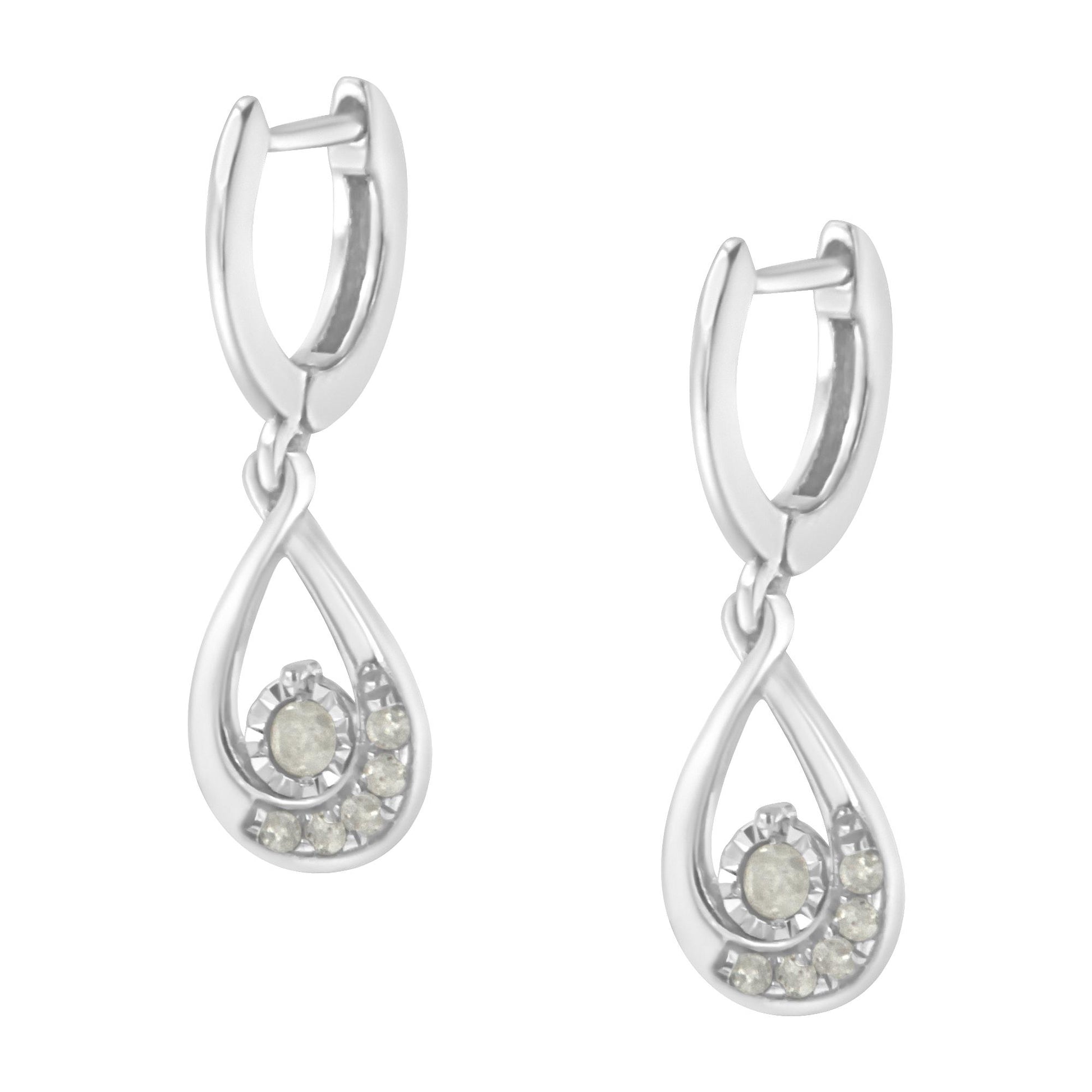 Front view of a pair of white metal drop earrings with a teardrop-shaped design featuring round white gemstones in a pave setting.