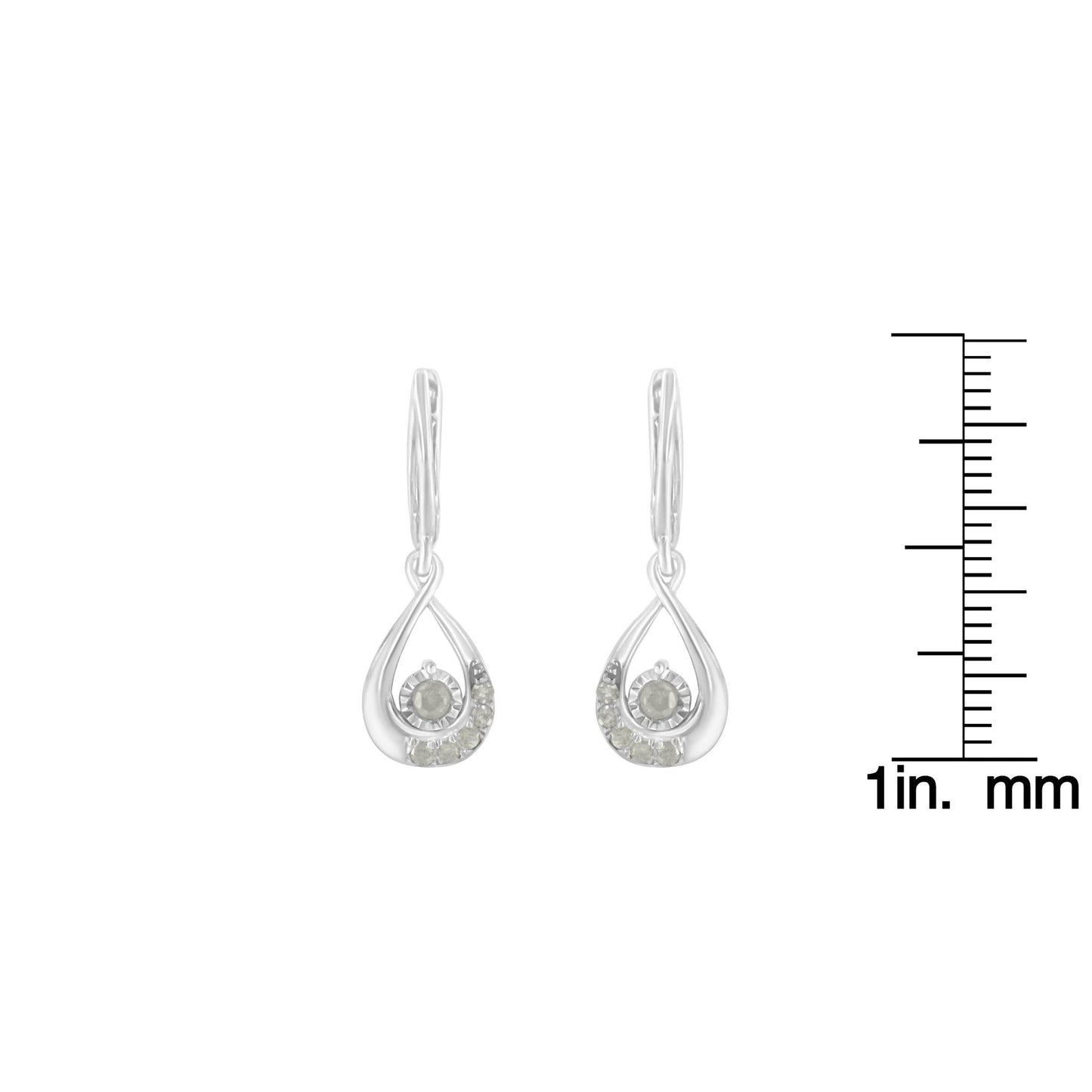 Pair of white metal drop earrings with round white gemstones in pave setting, front view on a ruler for size reference.