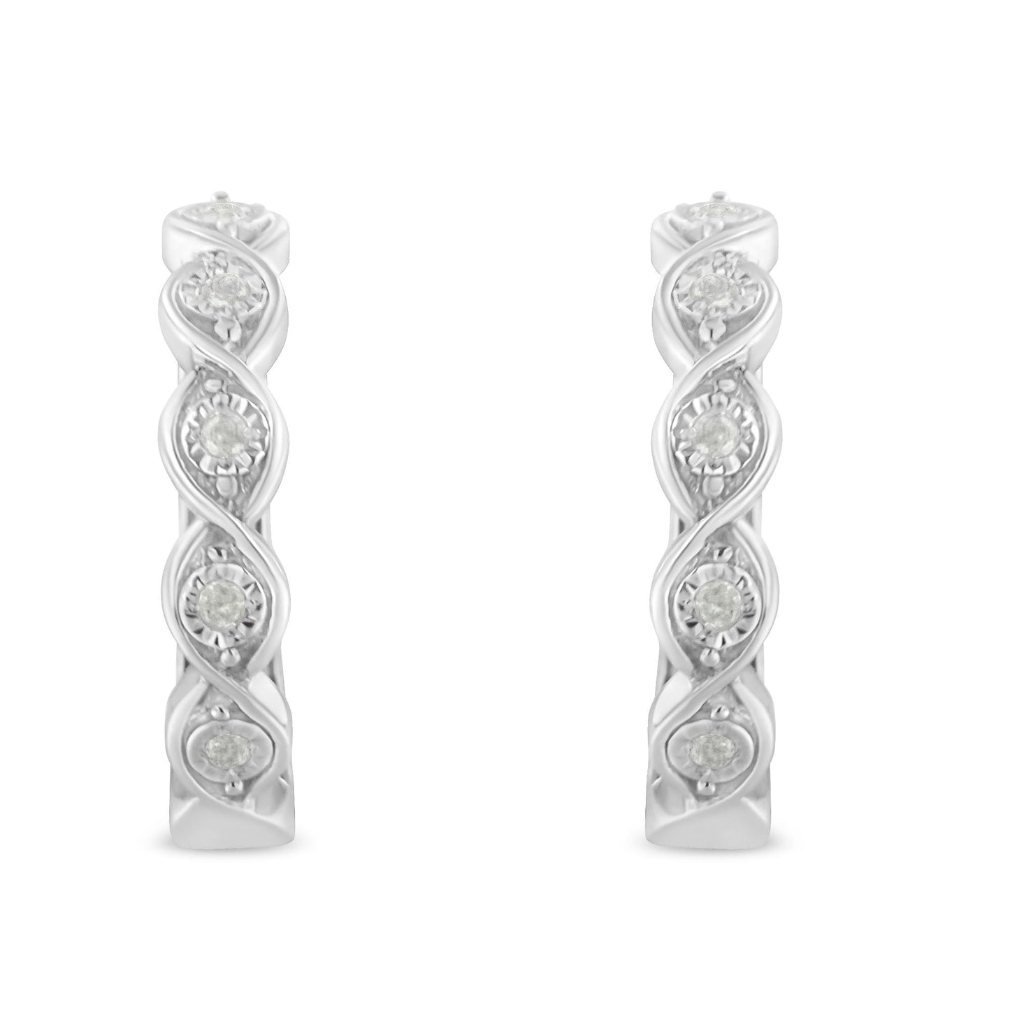 Front-facing shot of white metal hoop earrings featuring round white gemstones in a twisted design.