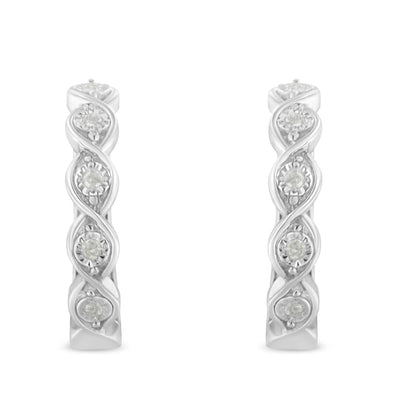 Front-facing shot of white metal hoop earrings featuring round white gemstones in a twisted design.