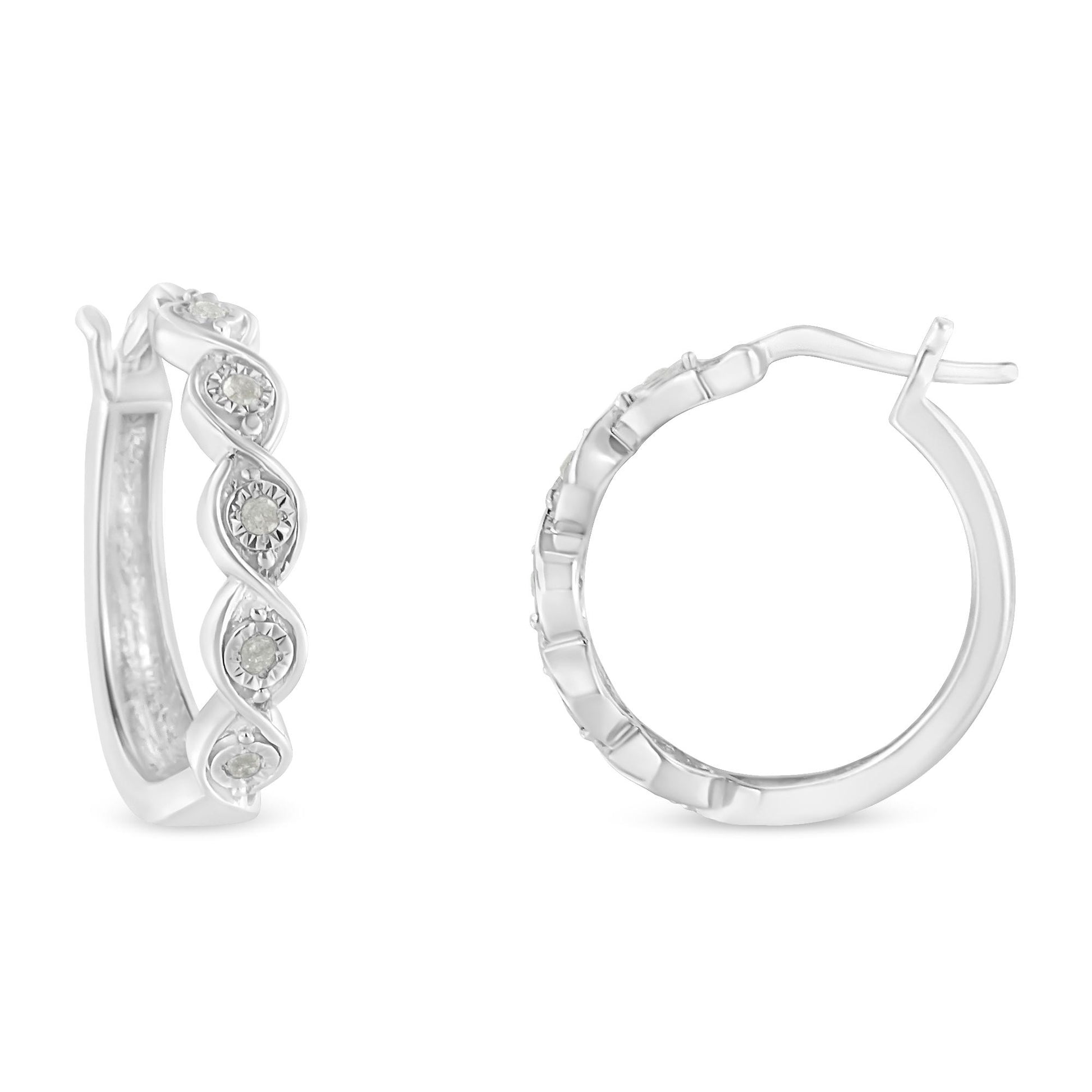 Pair of white metal hoop earrings with round white gemstones in miracle settings, shown from front and side angles.