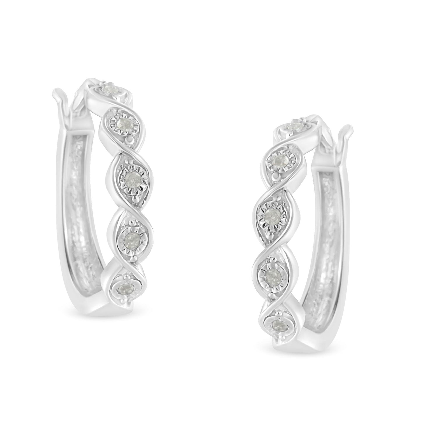 Pair of white metal hoop earrings with twisted design and round white gemstones set in a miracle setting, shown from a front angle.