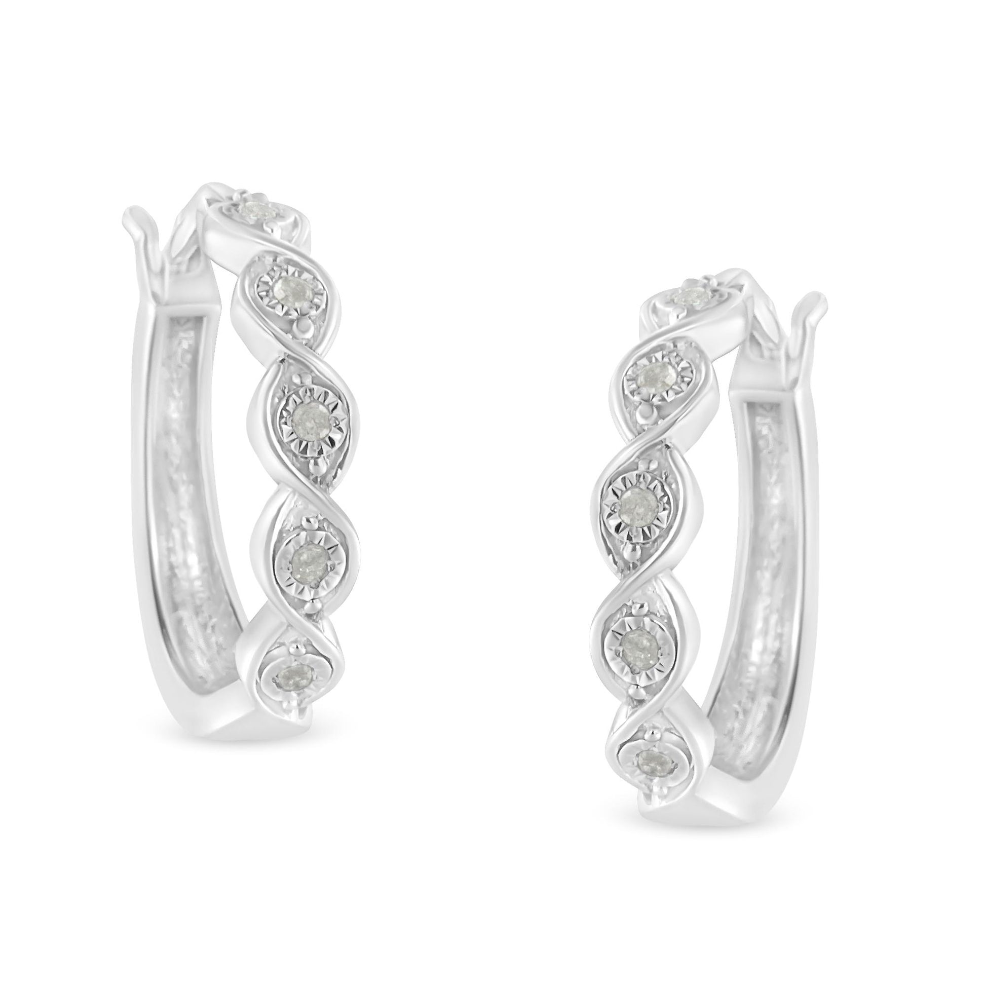 Pair of white metal hoop earrings with twisted design and round white gemstones set in a miracle setting, shown from a front angle.