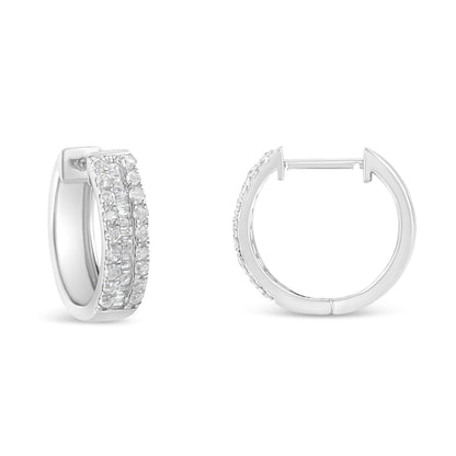 Pair of white metal hoop earrings with round and baguette white gemstones, shown from front and side angles.