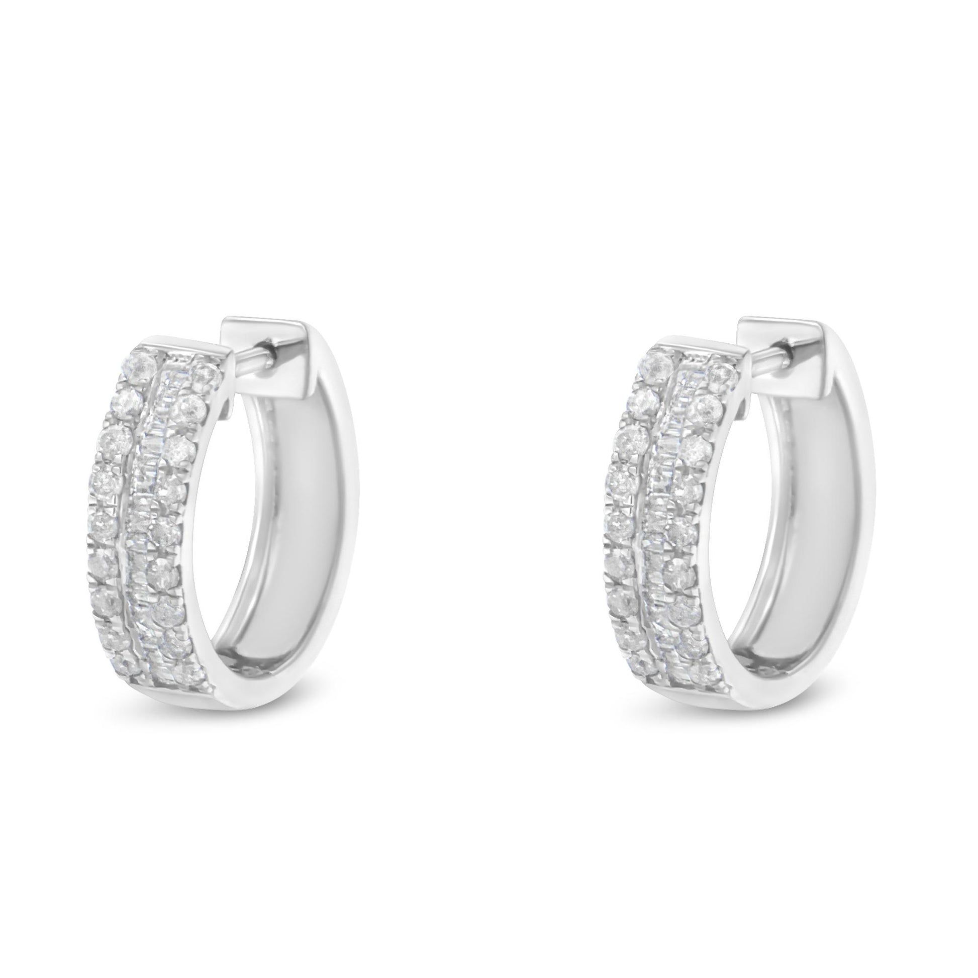 Front angled view of a pair of white hoop earrings featuring two rows of pave set round white gemstones on the outer edge and a center row of channel set baguette white gemstones.