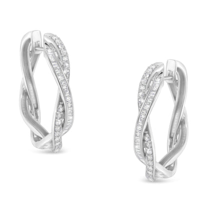 Front angle view of a pair of white metal earrings with intertwined bands featuring round prong-set and baguette channel-set white gemstones.