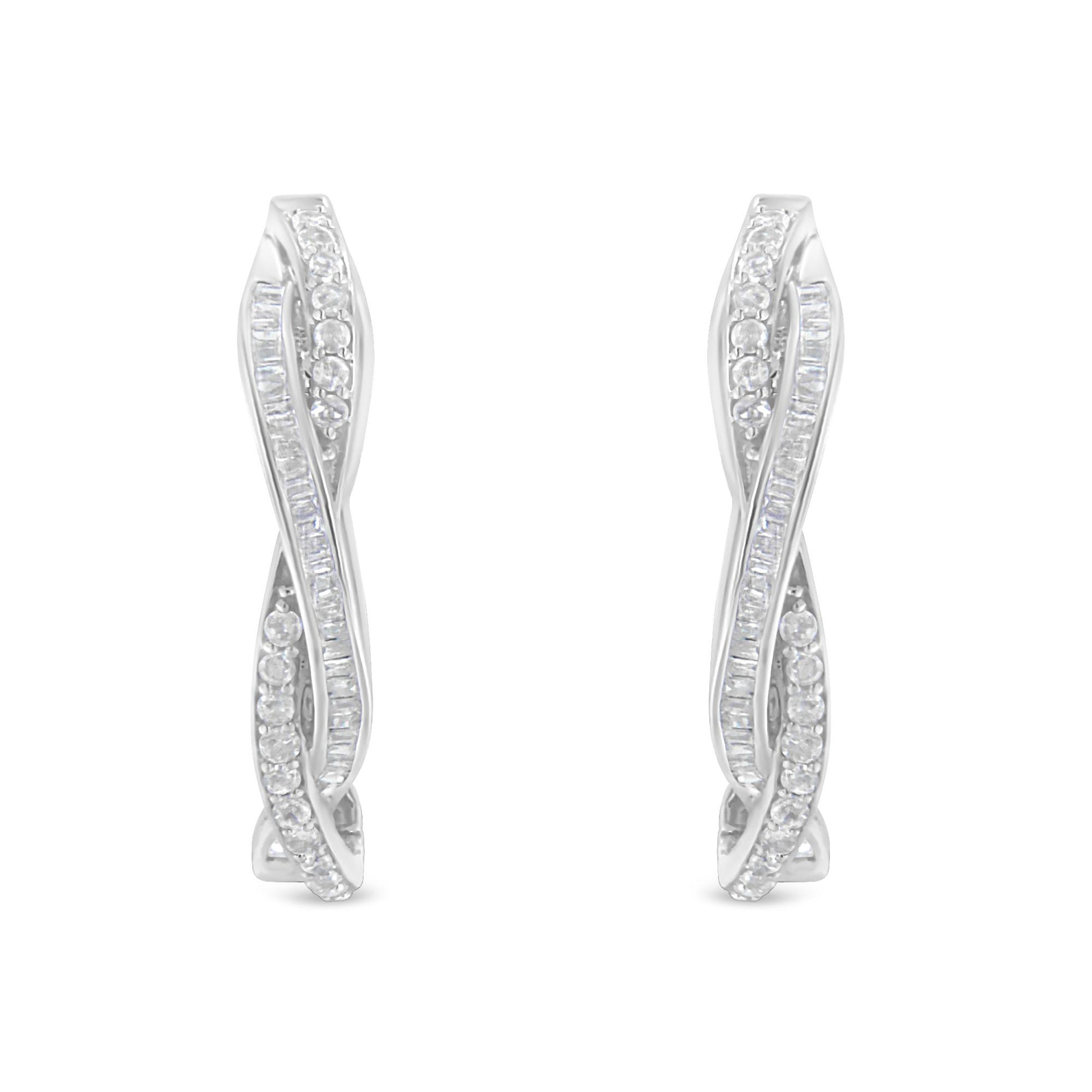 Front-facing view of white metal earrings with twisting design featuring rows of round and baguette-shaped white gemstones in prong and channel settings.